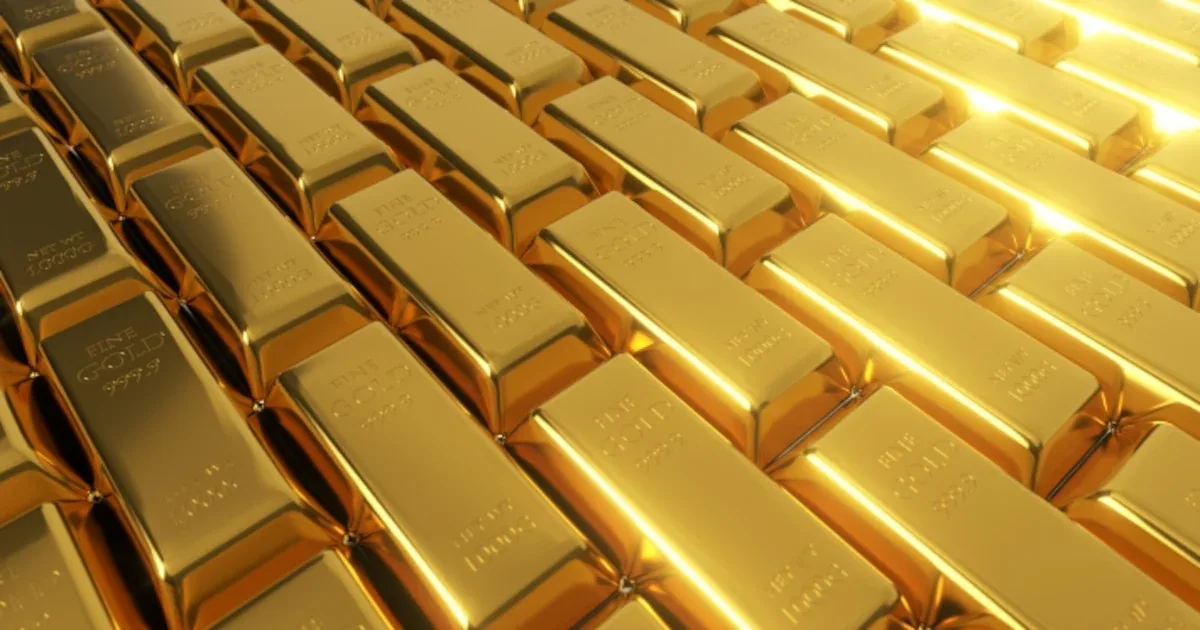 Ouro recua com pressão sobre juros e dólar mais forte